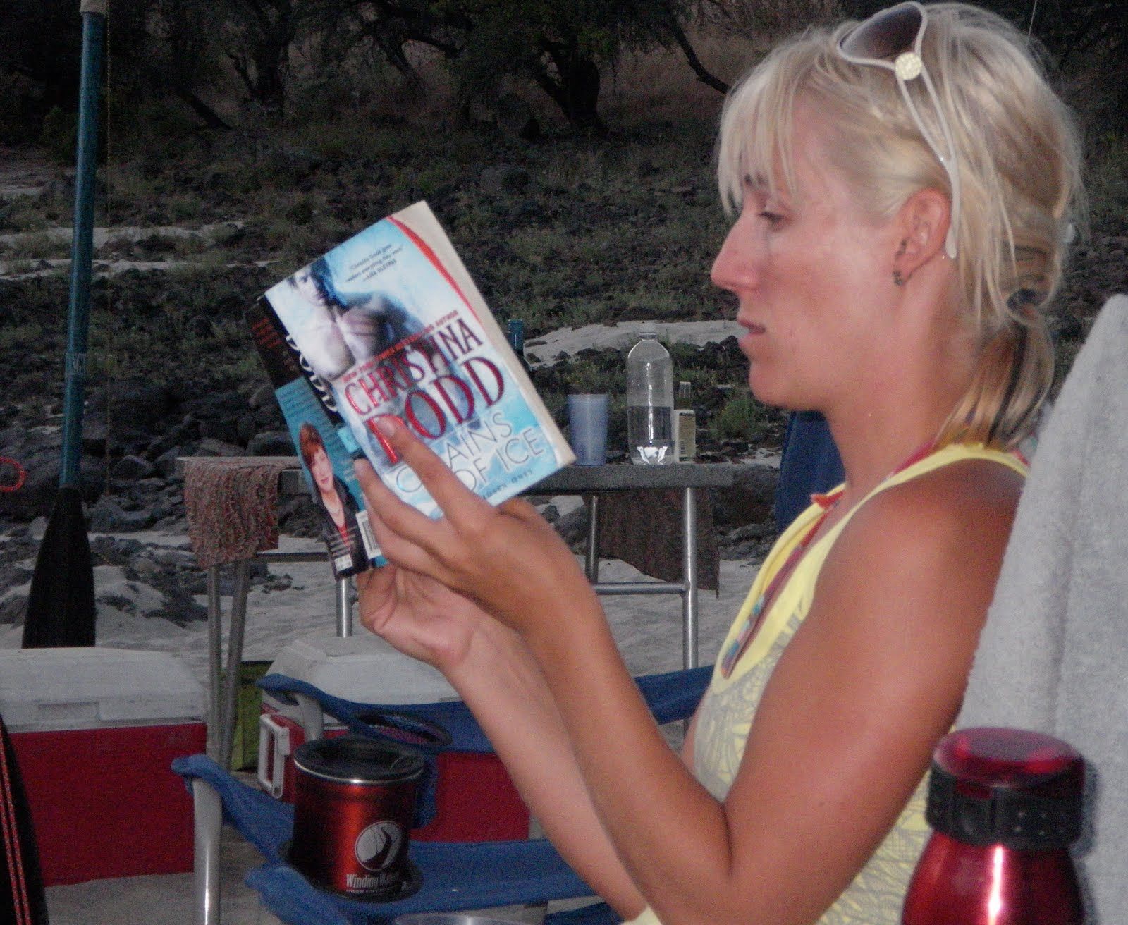A woman is reading a book called odd