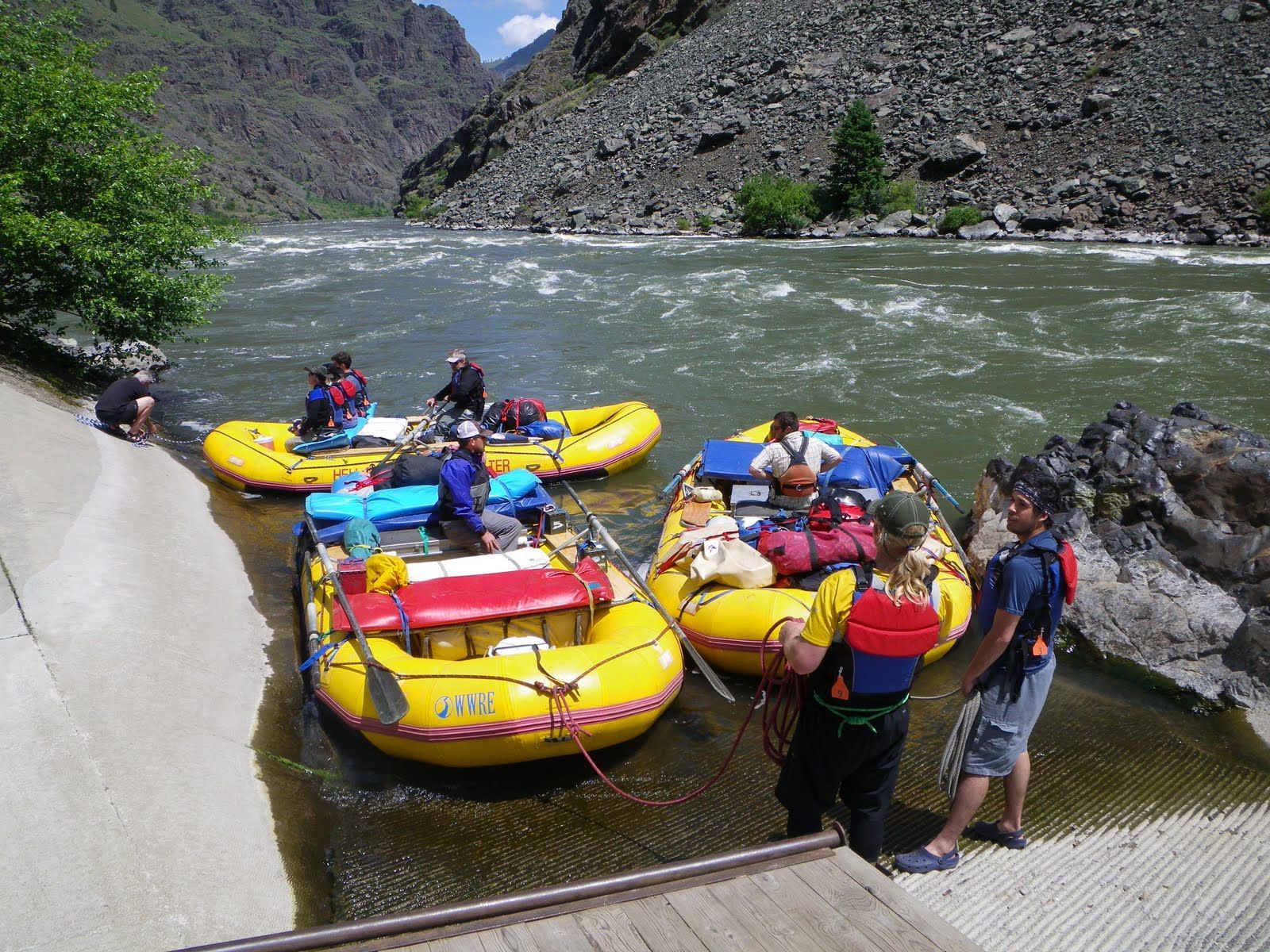 A group of people are in rafts on a river