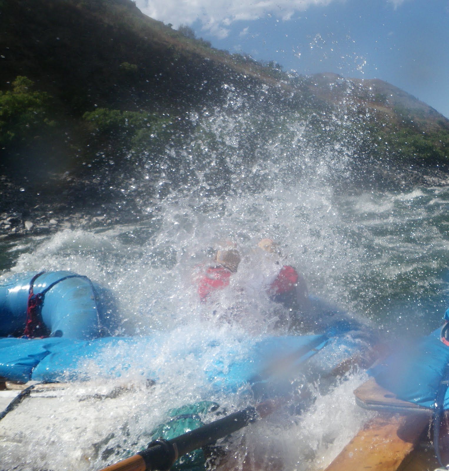 A group of people are rafting down a river