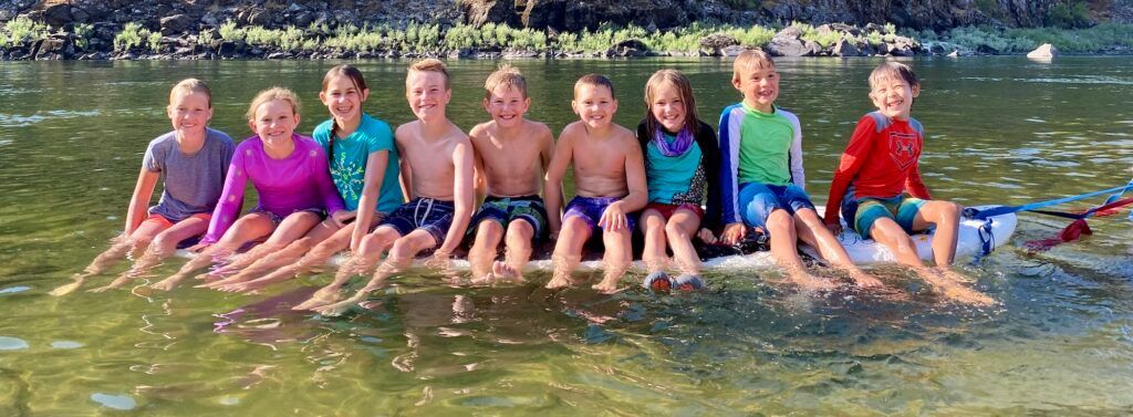 Children Posing for A Picture in Water
