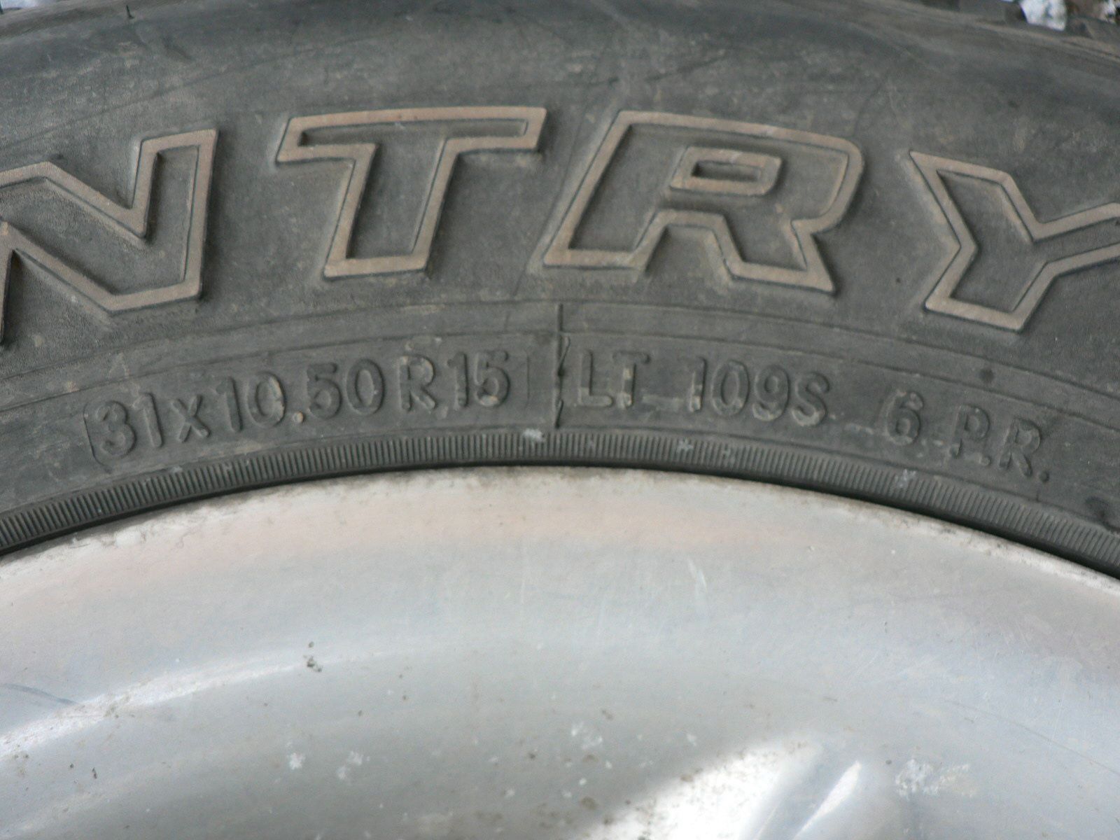 A close up of a tire with the word ntry on it.