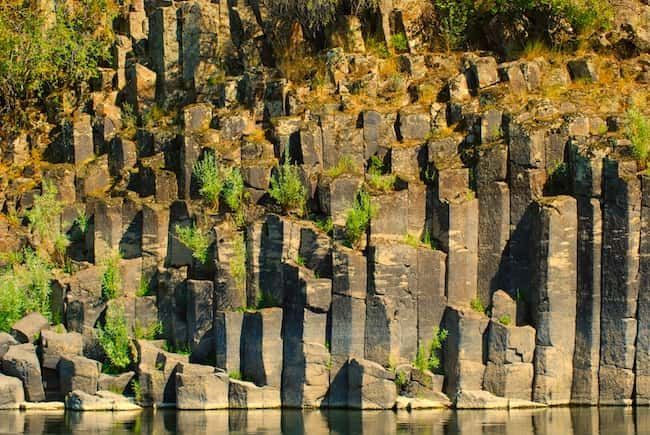 Large Rock Formation Next to A Body of Water