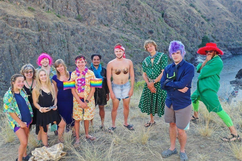 Group of People Are Posing for A Picture on Top of A Hill