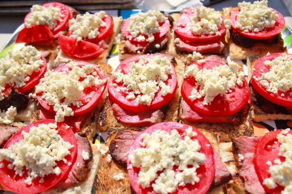 Sandwich with Tomatoes and Cheese on A Table