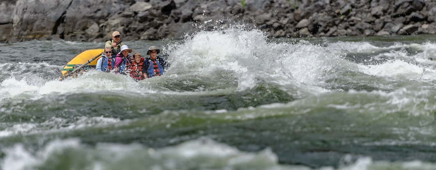 A group of people are rafting down a river.