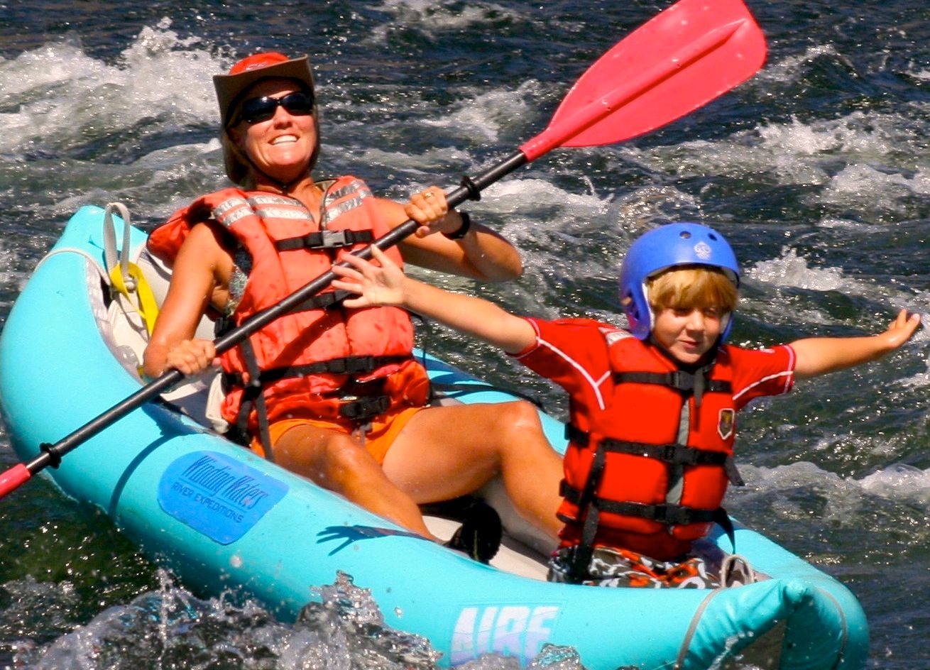 A Woman and A Child Are in A Raft