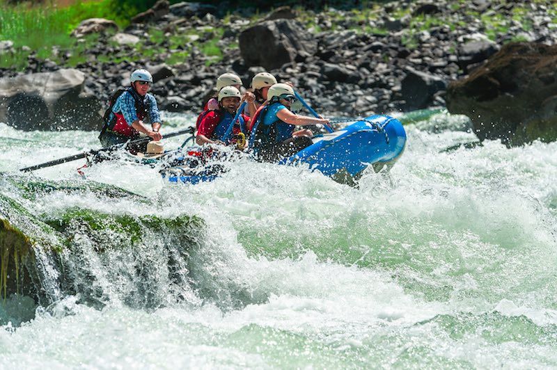 A group of people are rafting down a river.