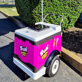 A green cart with the words celebrating pride on it