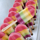 A row of ice pops with different flavors on them
