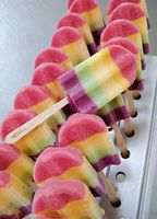 A row of ice pops with different flavors on them