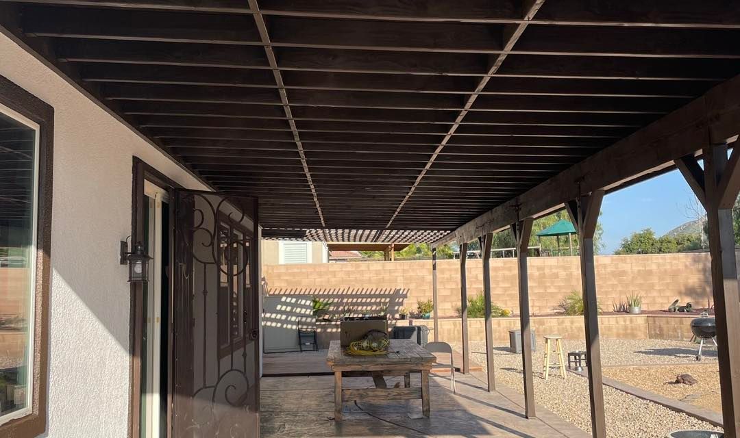 Image of an deck and patio that are getting a painting job. 