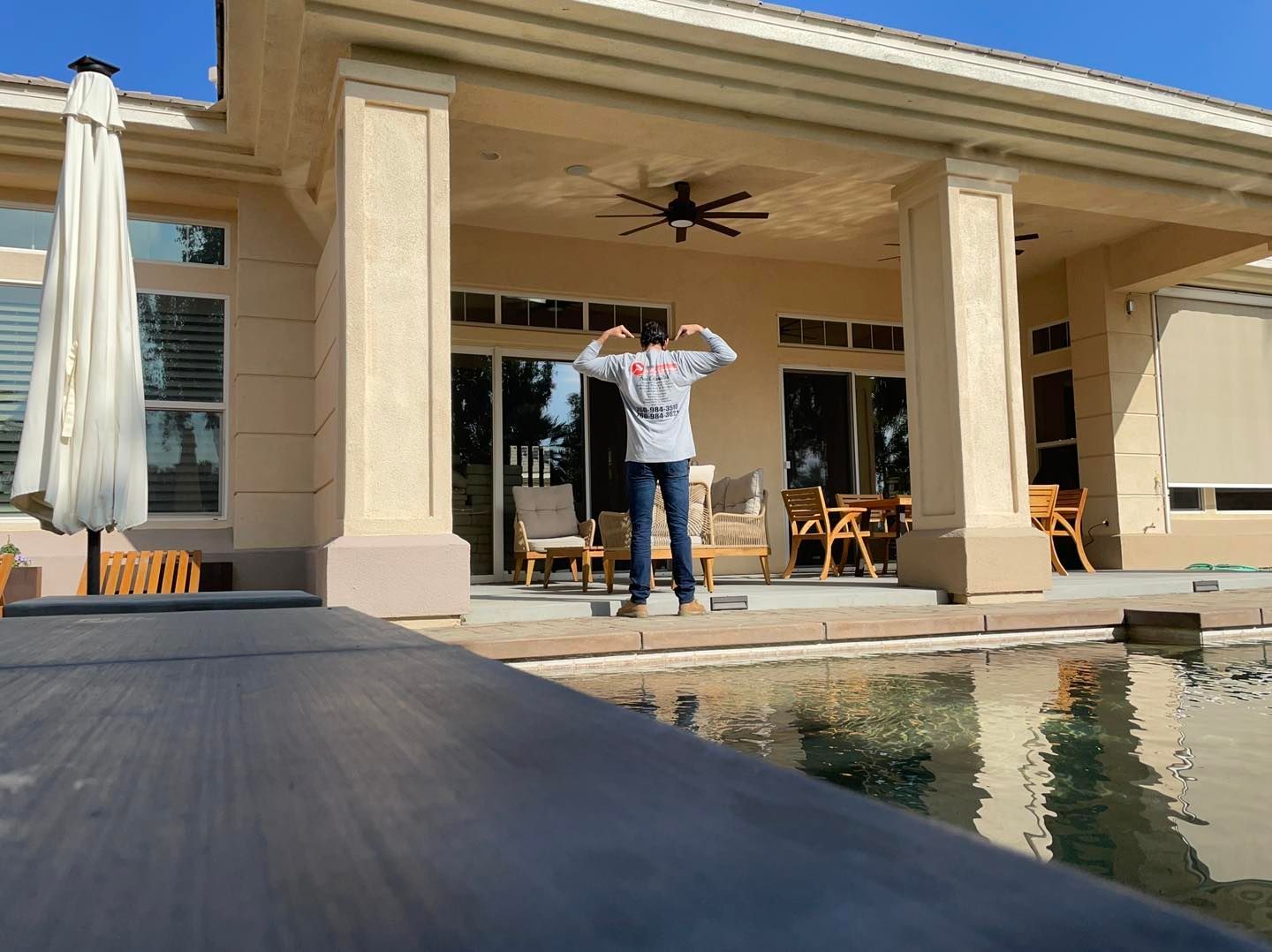 Picture of a team member of Desert innovations painting and handyman standing on a nice patio in Coachella Valley, Ca.