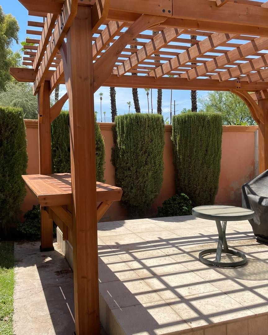 Image of an outdoor pergola that is offering nice shade on a hot day in Coachella Valley. 