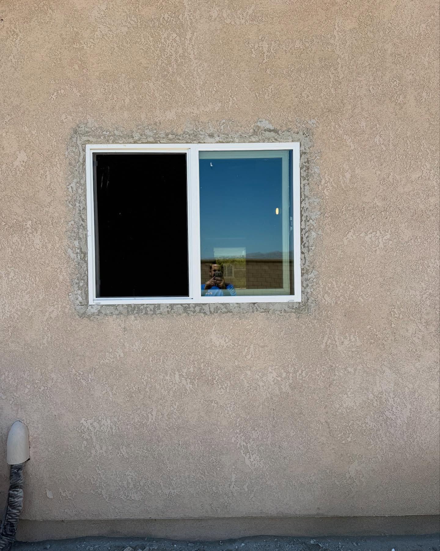Picture of the same wall, now with the window installed after the guys from Desert innovations painting and handyman came by and installed it very well. 