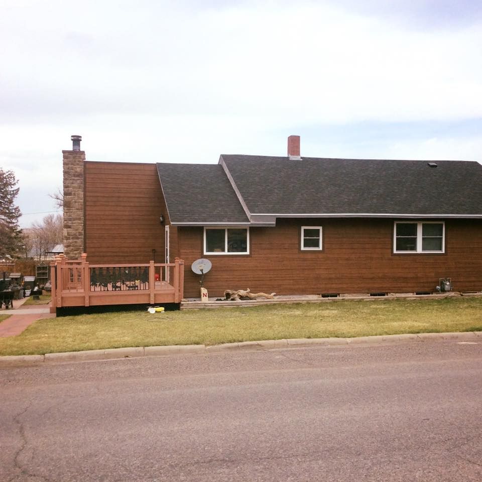 A house with a satellite dish on the side of it