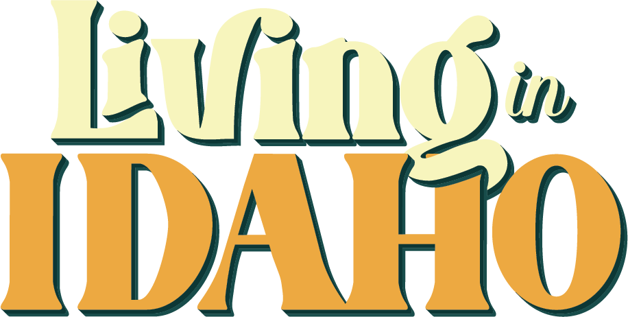 The logo for living in idaho is yellow and orange