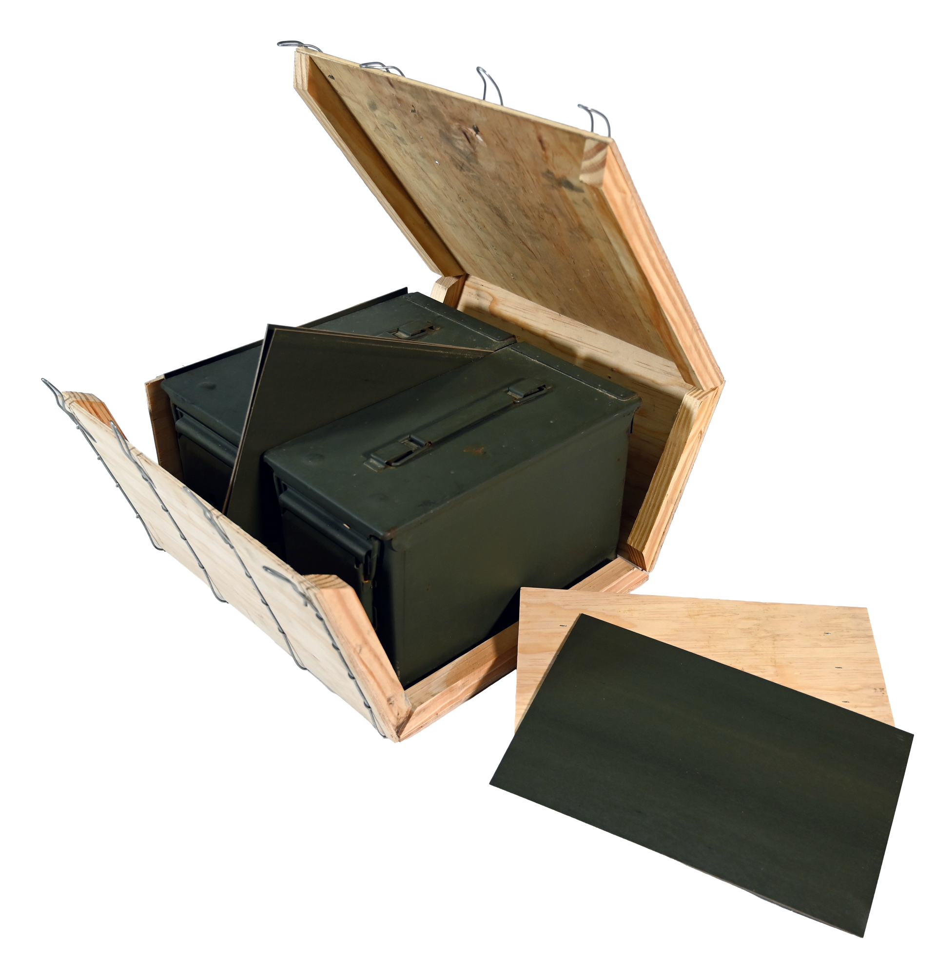 Wooden box frame under construction, set on a plywood surface with tools, in a workshop.