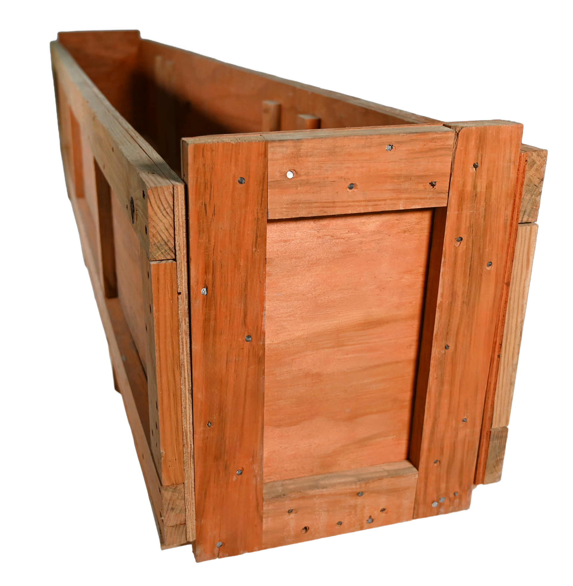 Wooden box frame under construction, set on a plywood surface with tools, in a workshop.
