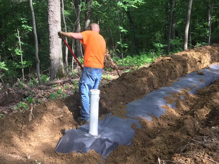 Man Fixing Pipe — Black River Falls, WI — Callahan & Son Plumbing & Septic Man Fixing Pipe — Black River Falls, WI — Callahan & Son Plumbing & Septic