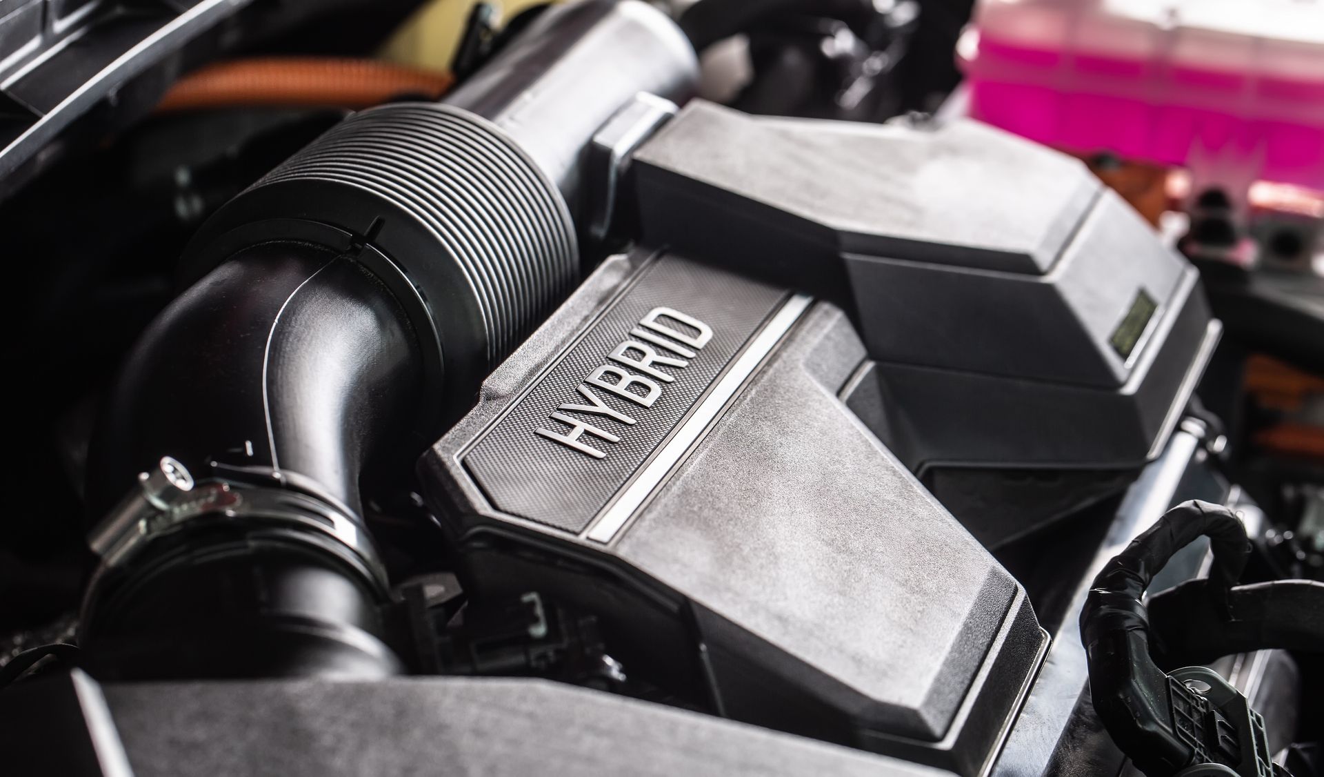 A close up of a hybrid engine in a car.