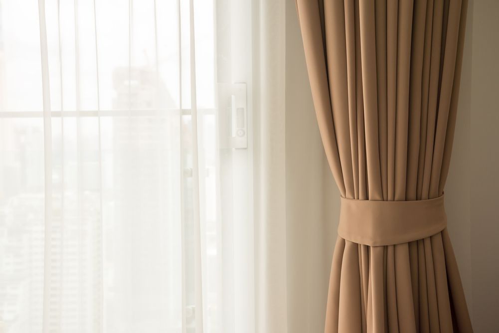 A Close Up of a Pair of Curtains Hanging on a Window — Wow Clean Cairns in Edmonton, QLD
