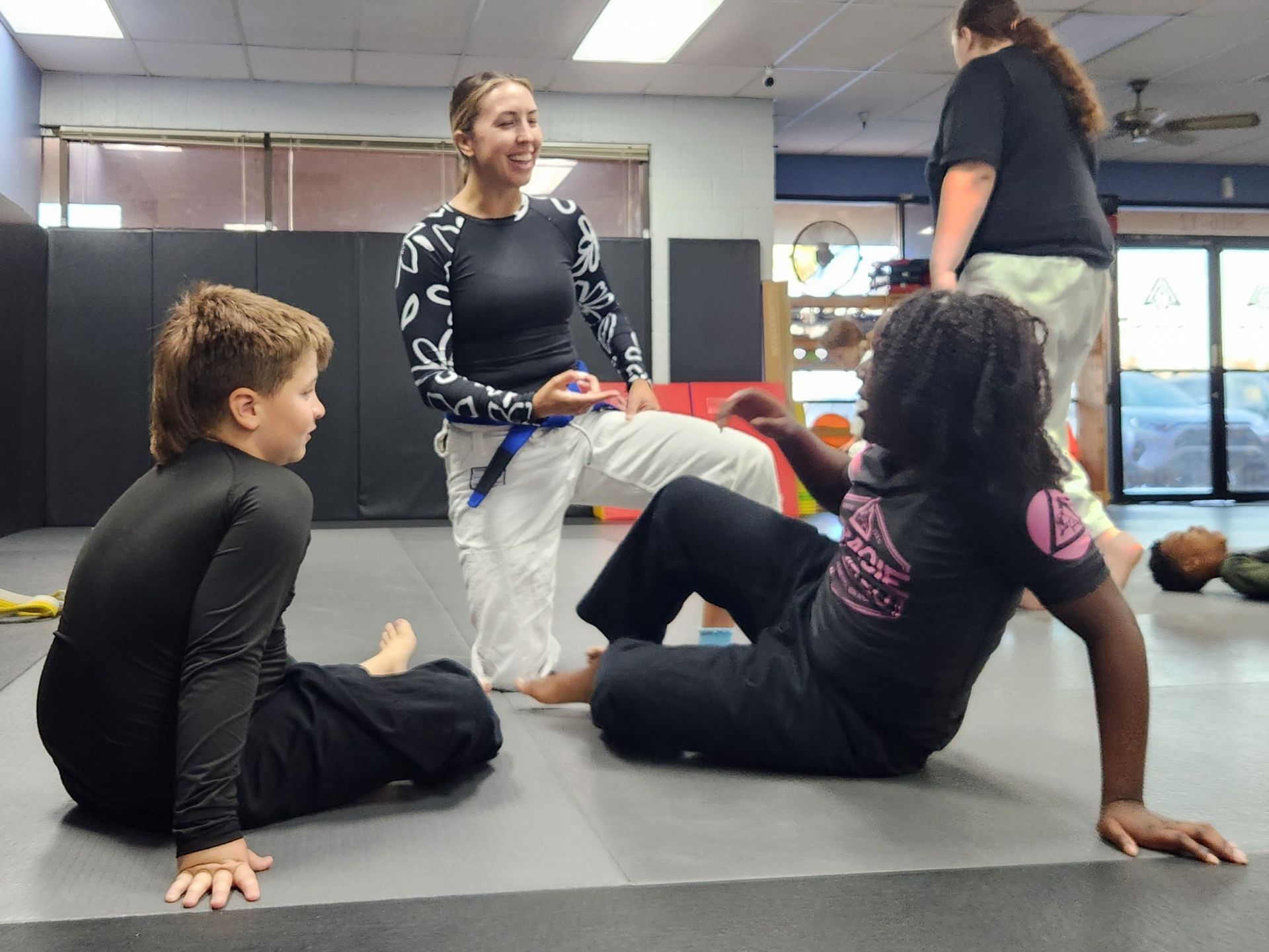 Family students practicing controlled grappling at Centerline Jiu-Jitsu Chandler in Chandler, AZ.