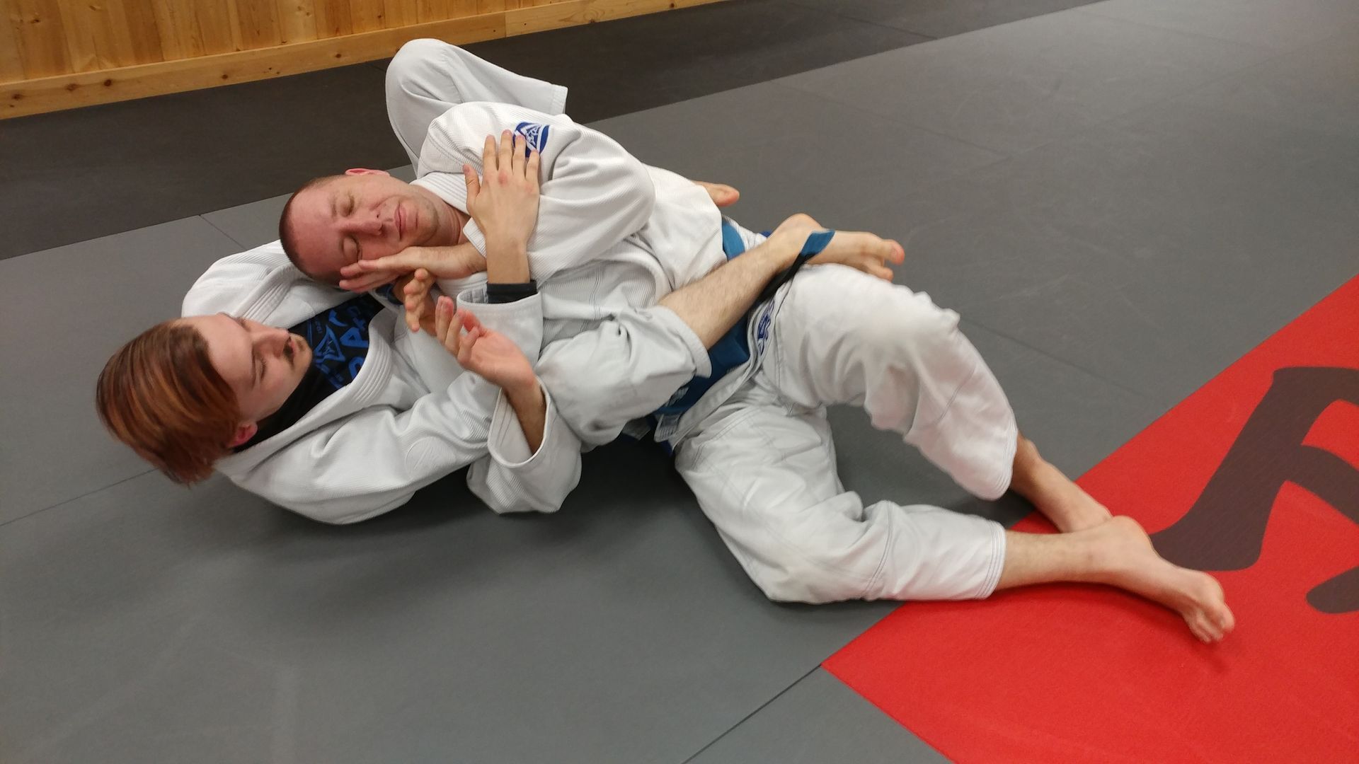 Adults drilling beginner Brazilian Jiu-Jitsu techniques at Centerline Jiu-Jitsu Chandler in Chandler