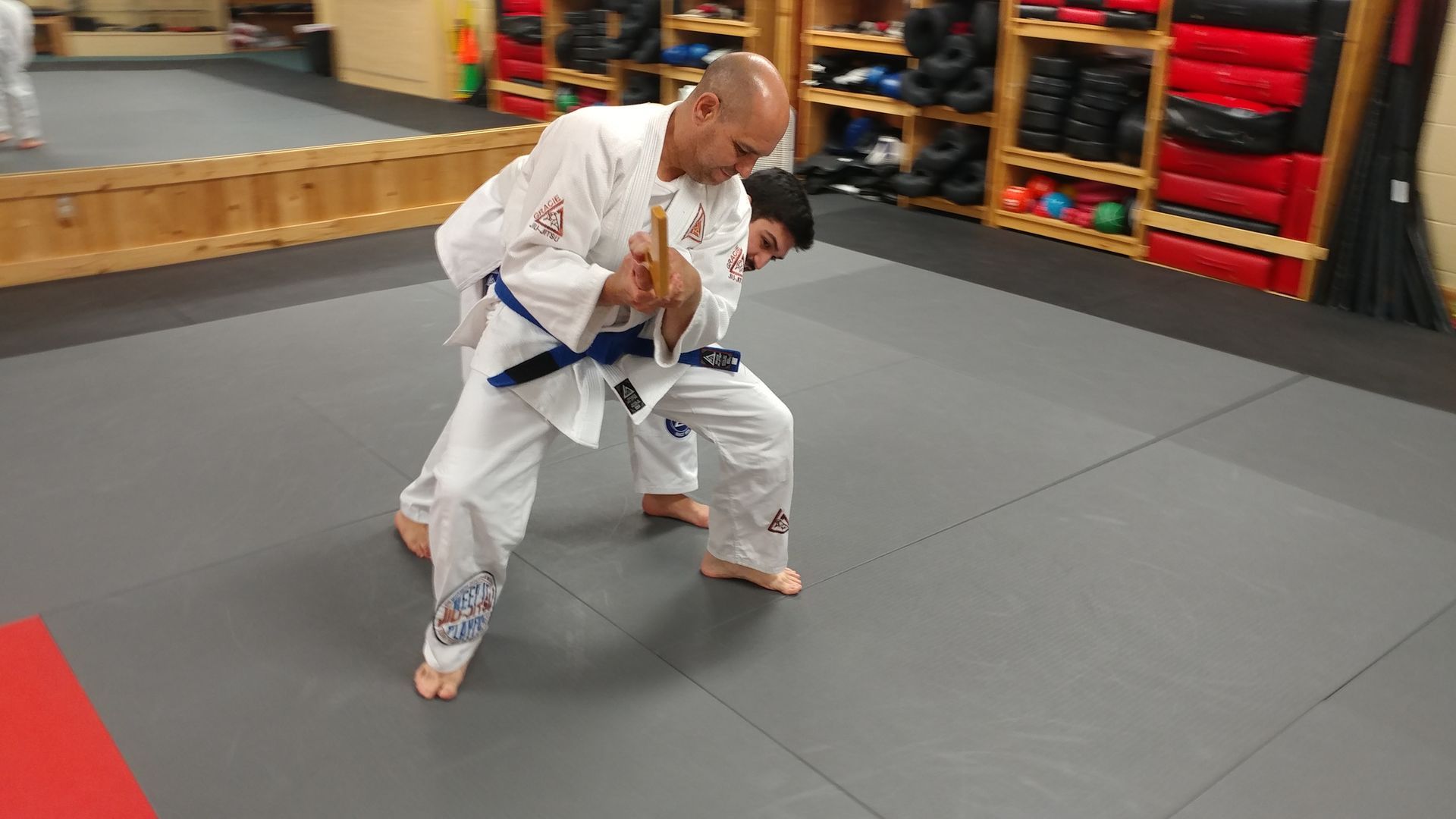 Adults drilling jiu jitsu fundamentals at Centerline Jiu-Jitsu Chandler in Chandler, AZ.