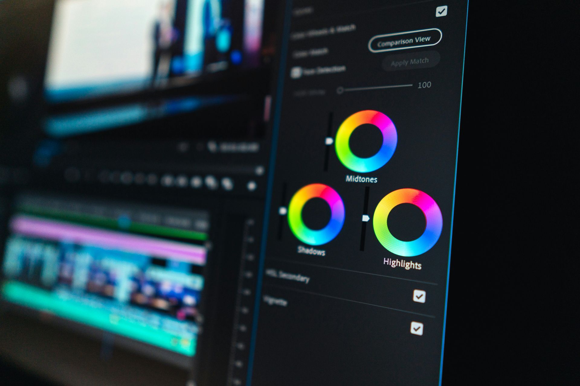 A close-up of a computer screen showing color correction tools, including color wheels.