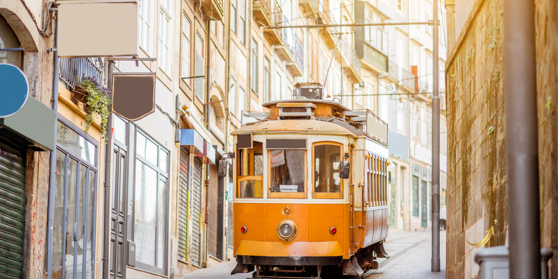 Orange tram on a narrow sunlit street between tall buildings