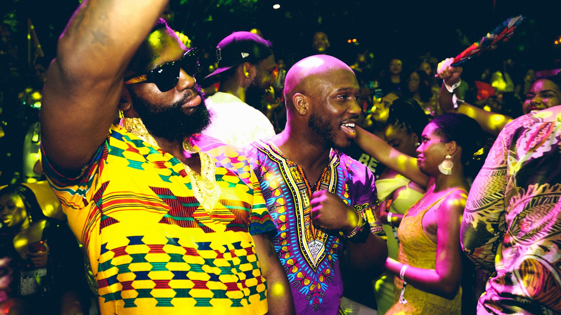 A group of people are dancing in a club.