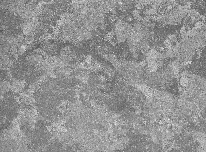 Gray, textured concrete surface with a mottled appearance.