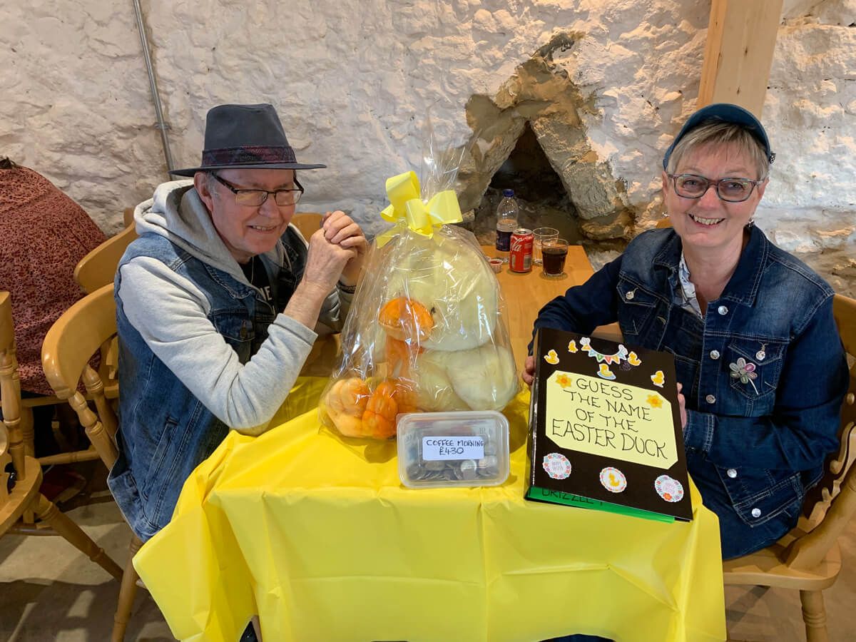 John and Dawn sat at a table at Grazers Café at the Isle of Wight Donkey Sanctuary