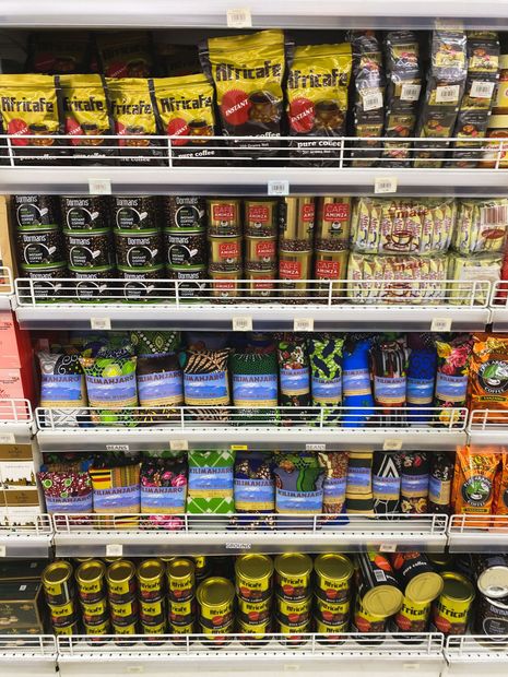 Store shelf stocked with assorted colorful snack and candy bags in a grocery aisle
