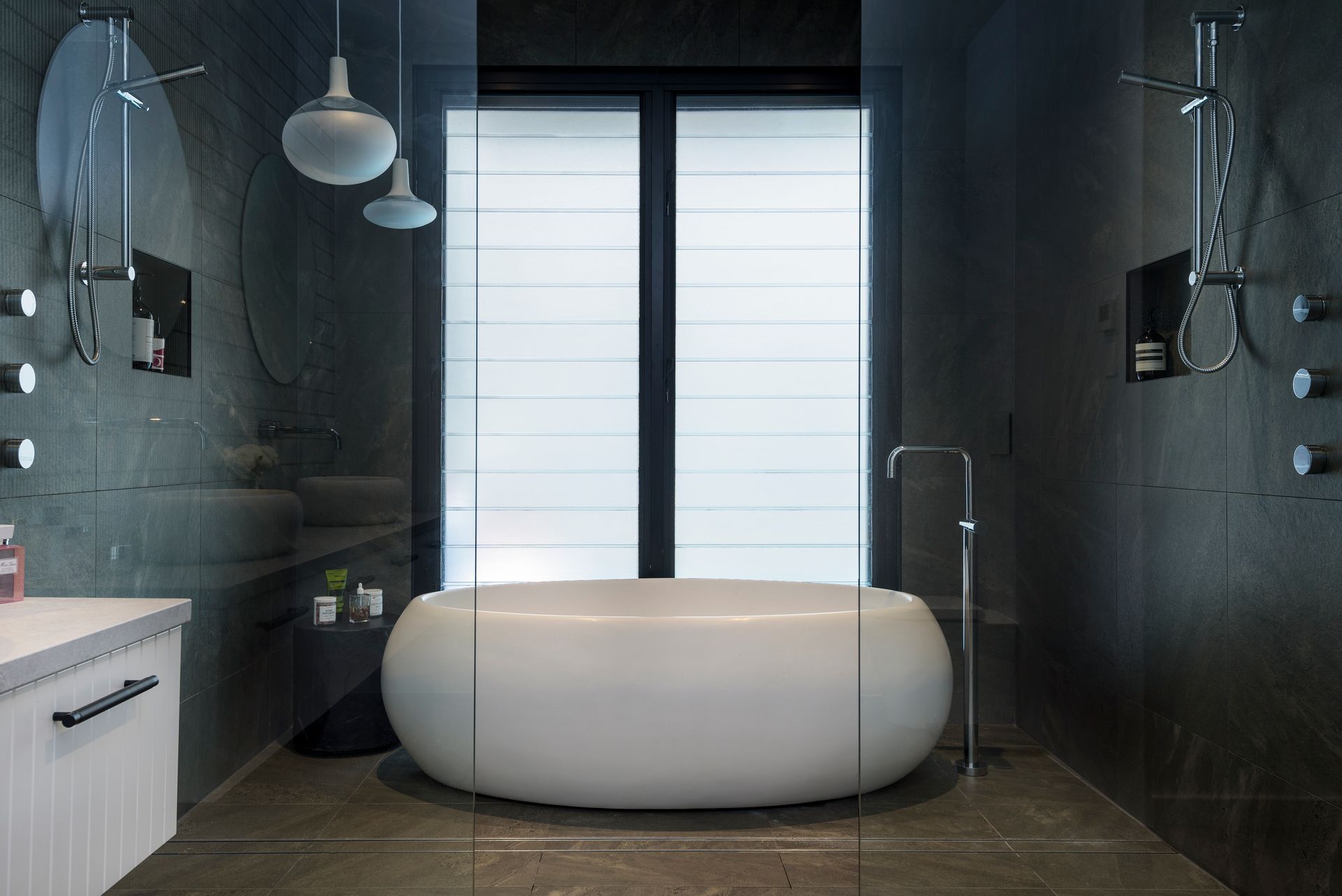 Large Stone Bathtub Sitting Centrally In Wet Room Bathroom — Star Glass Design Pty Ltd in Mayfield, NSW