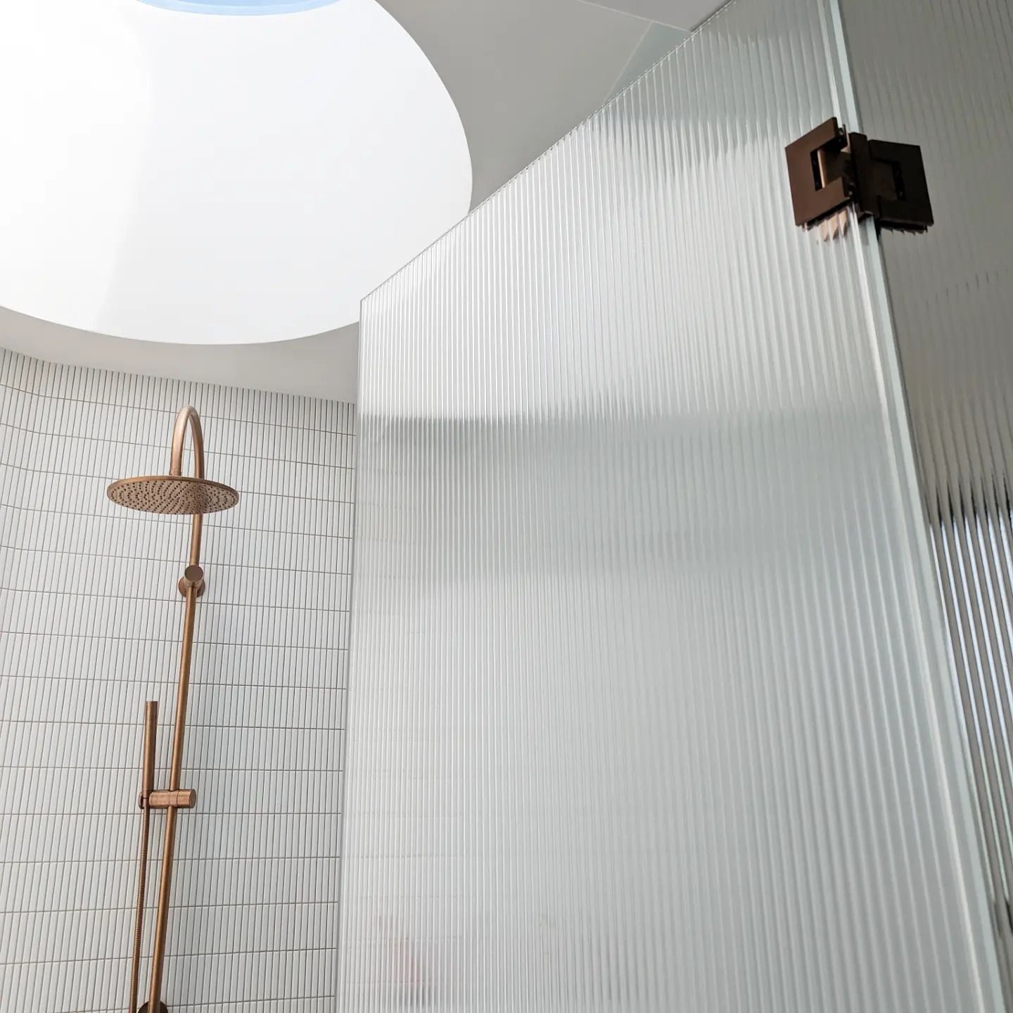 A Shower Stall Made From Fluted Glass And A Rainfall Style Shower Head — Star Glass Design Pty Ltd in Mayfield, NSW