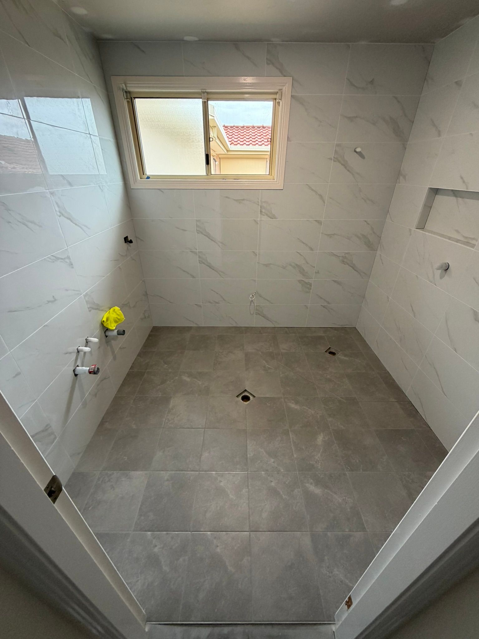 Pine Needles Erina bathroom completed floor and wall tiling