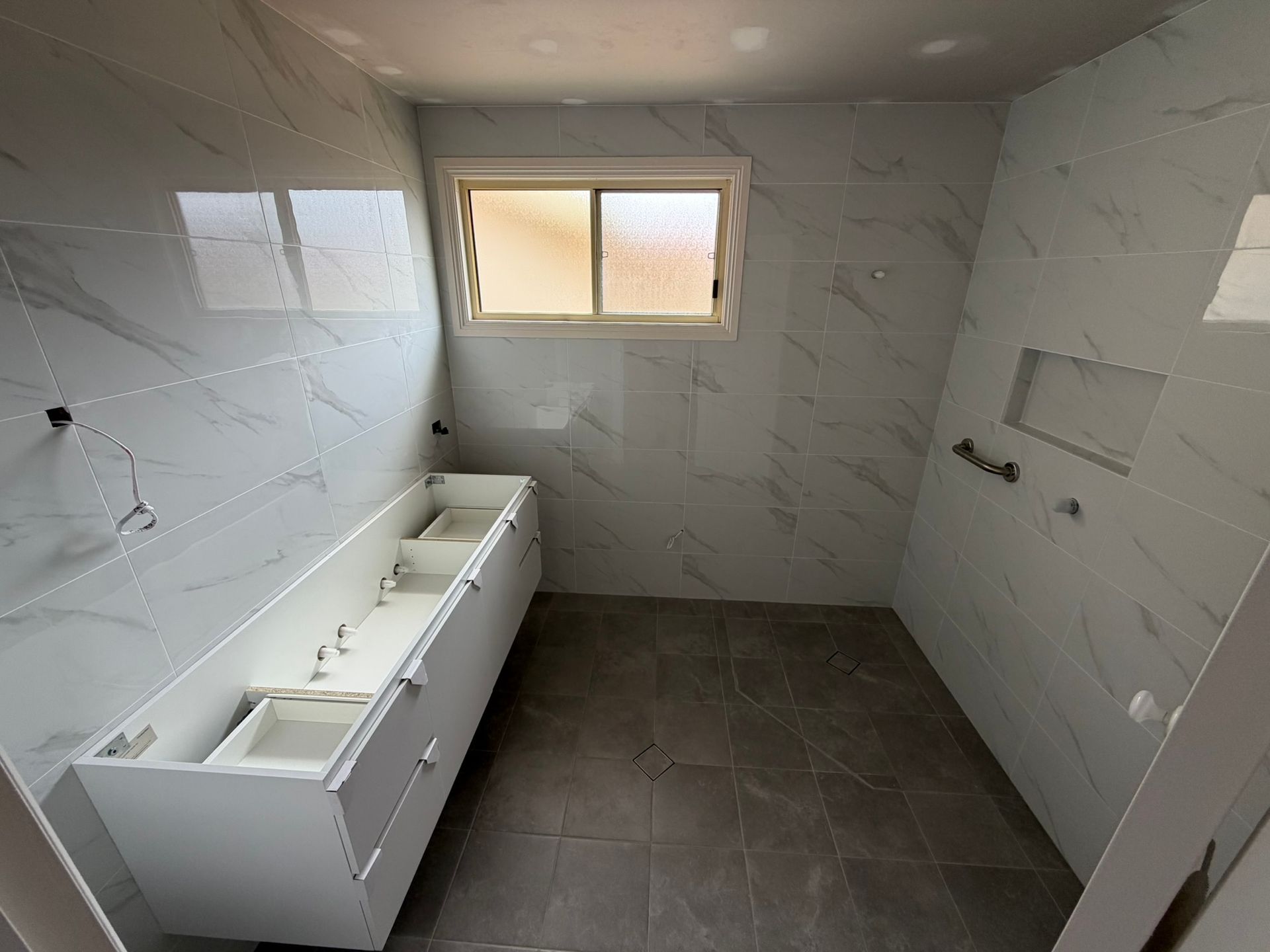 Pine Needles Erina bathroom completed floor and wall tiling