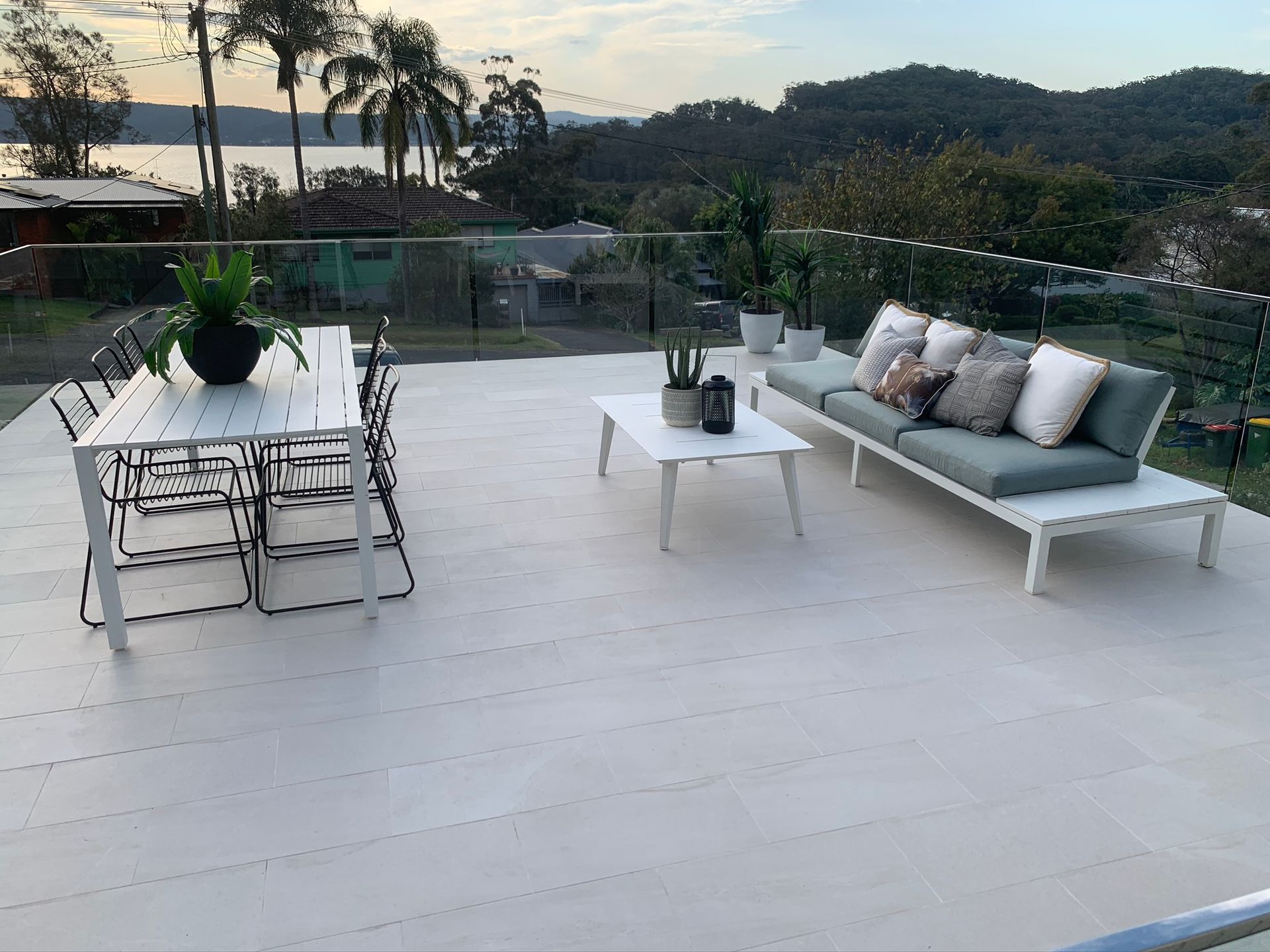 Yattalunga tiled outdoor living area with glass handrails