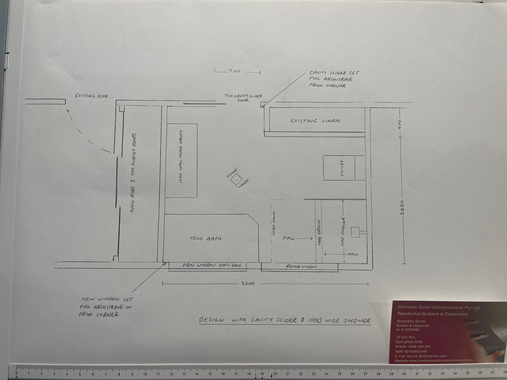 Blurred black-and-white architectural floor plan with measurements and labels on white paper.