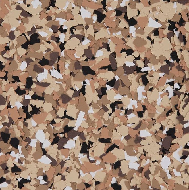 A blend of tan, brown, black, and white decorative floor flakes used for resinous flooring.