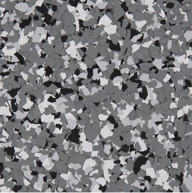 A decorative epoxy floor coating texture featuring a scattered blend of black, light gray, and dark gray flecks.