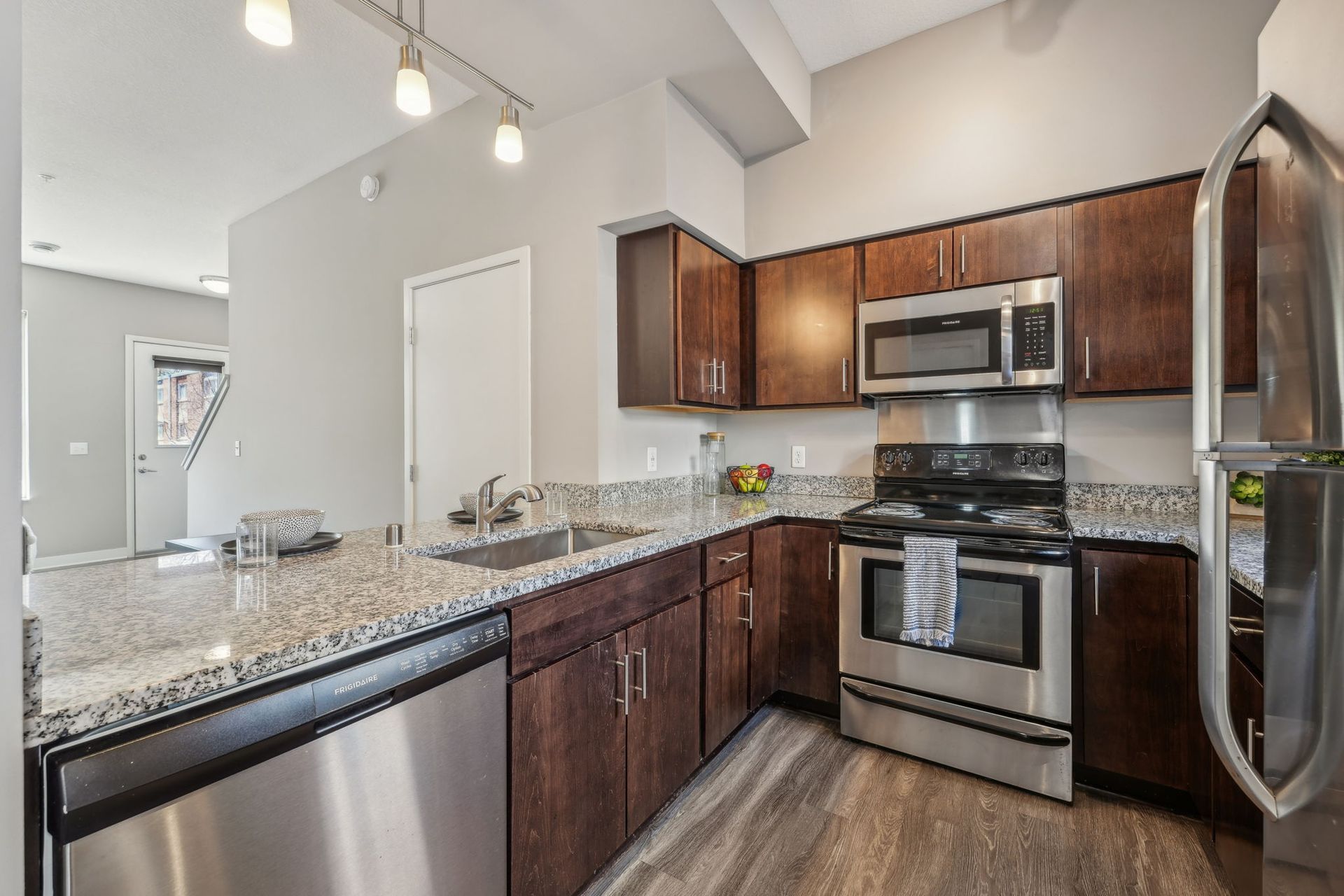 Kitchen with penninsula of multistory townhomes in Minneapolis, MN