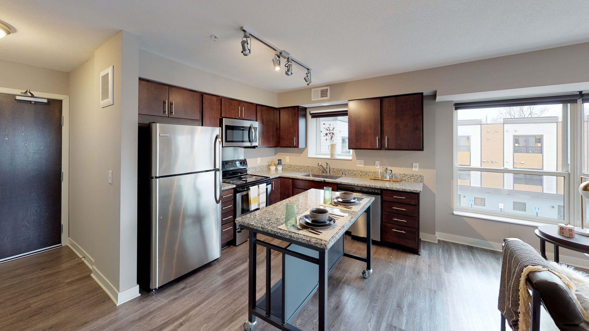 Kitchen with freestanding island at Spectrum apartments and townhomes in Minneapolis