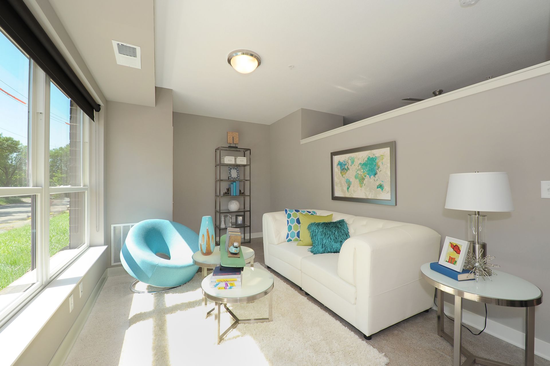 Living room with natural light and contemporary furniture at Spectrum apartments and townhomes in Minneapolis