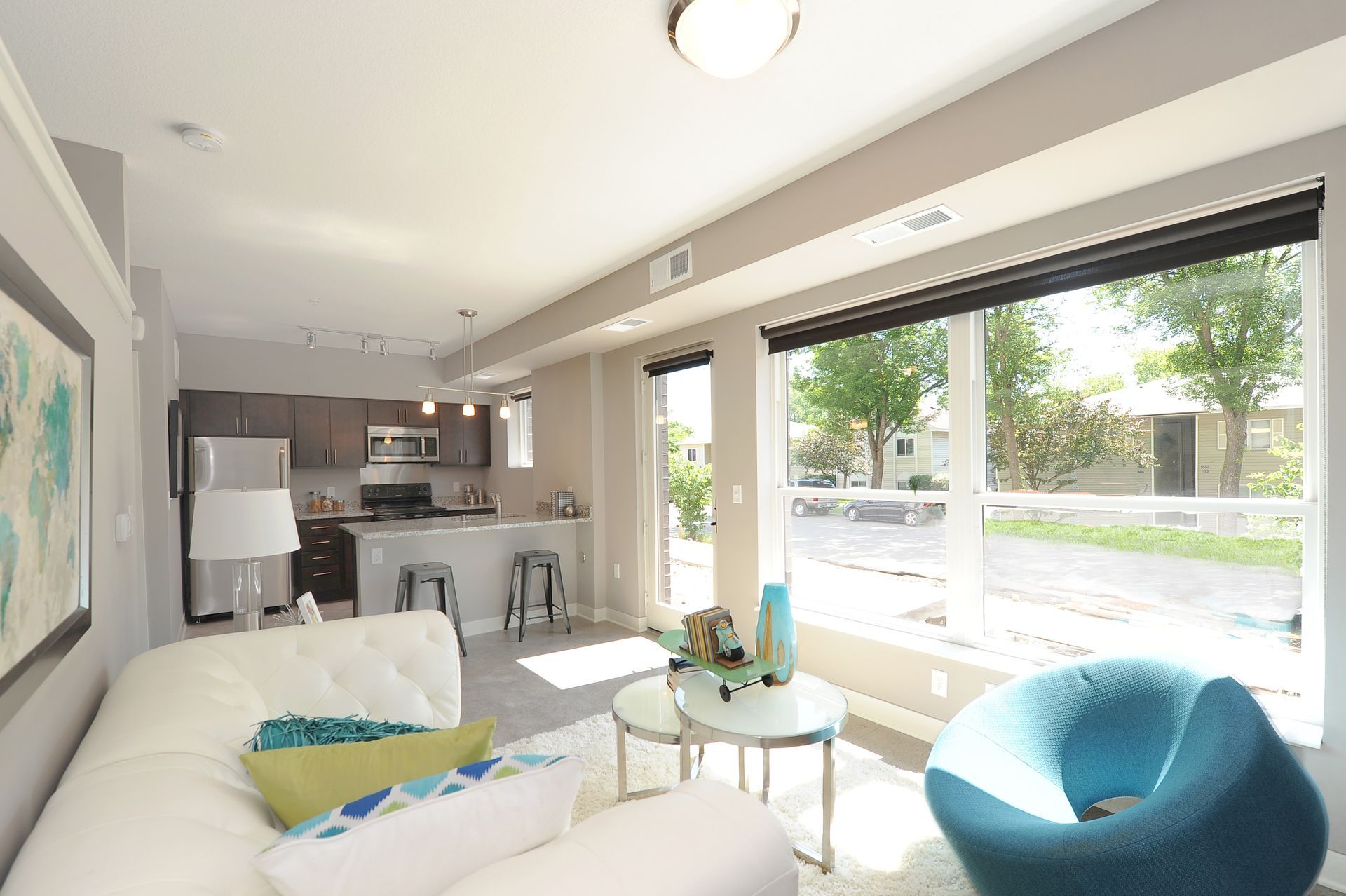 Kitchen and living room with huge windows at Spectrum apartments and townhomes in Minneapolis