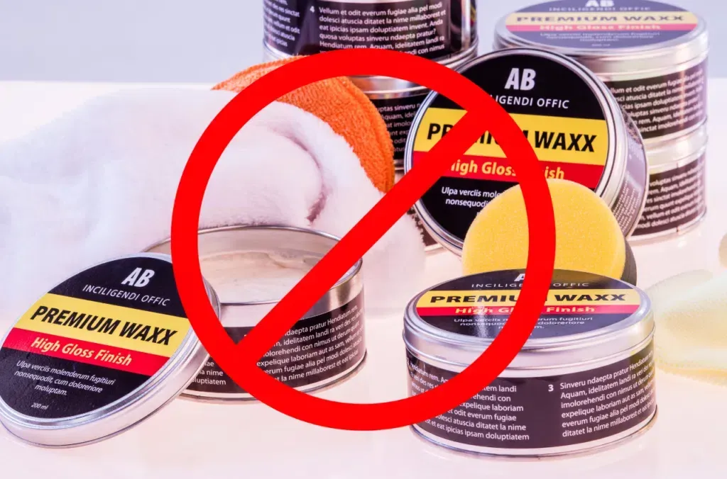 A group of cans of premium waxx with a red circle around them