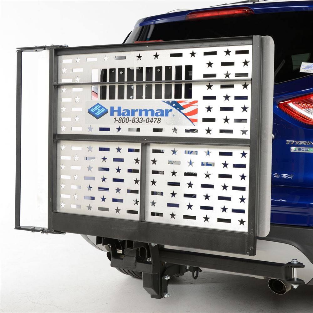 Blue SUV with rear wheelchair lift platform and black harness frame