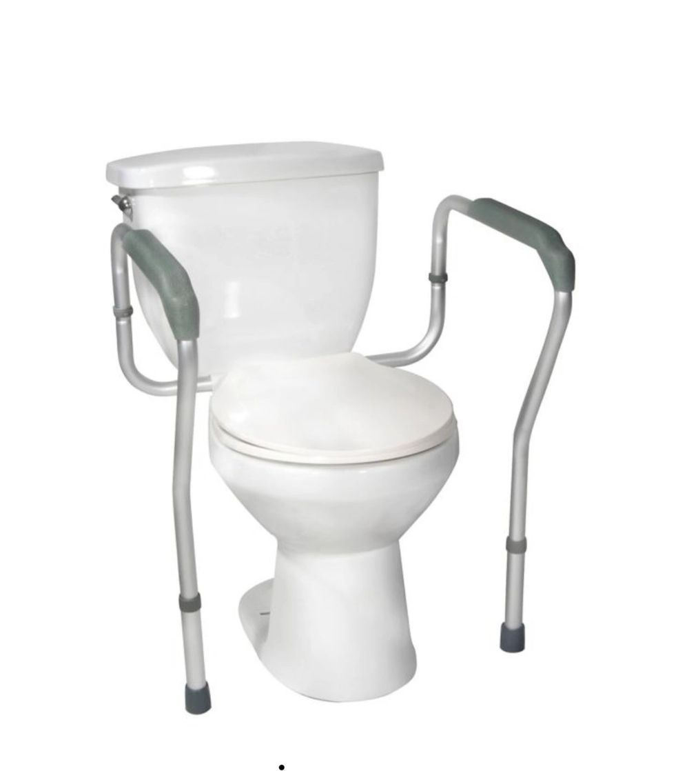 Toilet with white arm support rails and a raised seat, designed for bathroom accessibility
