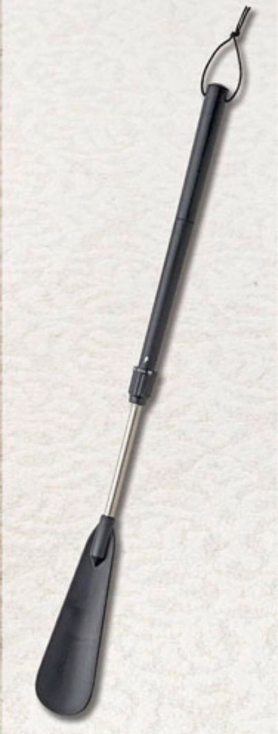 Black metal fireplace poker with a tapered handle and hanging loop, shown on a white background